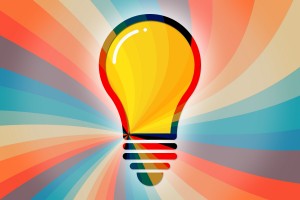 lightbulb icon with rainbow spiral background